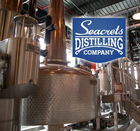 Seacrets Distilling Company logo and distilling system.