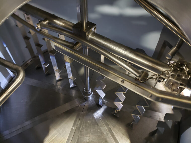 A close up inside a tank looking at the lautering rakes.