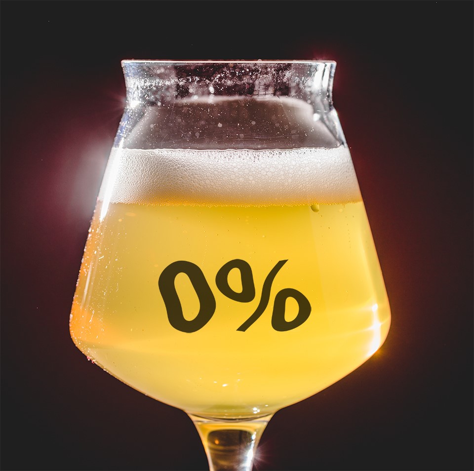 A glass of beer with zero percent on the side of the glass.